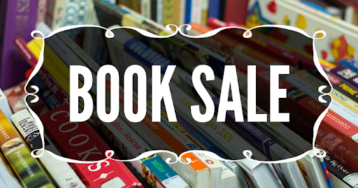 Book sale sign with books