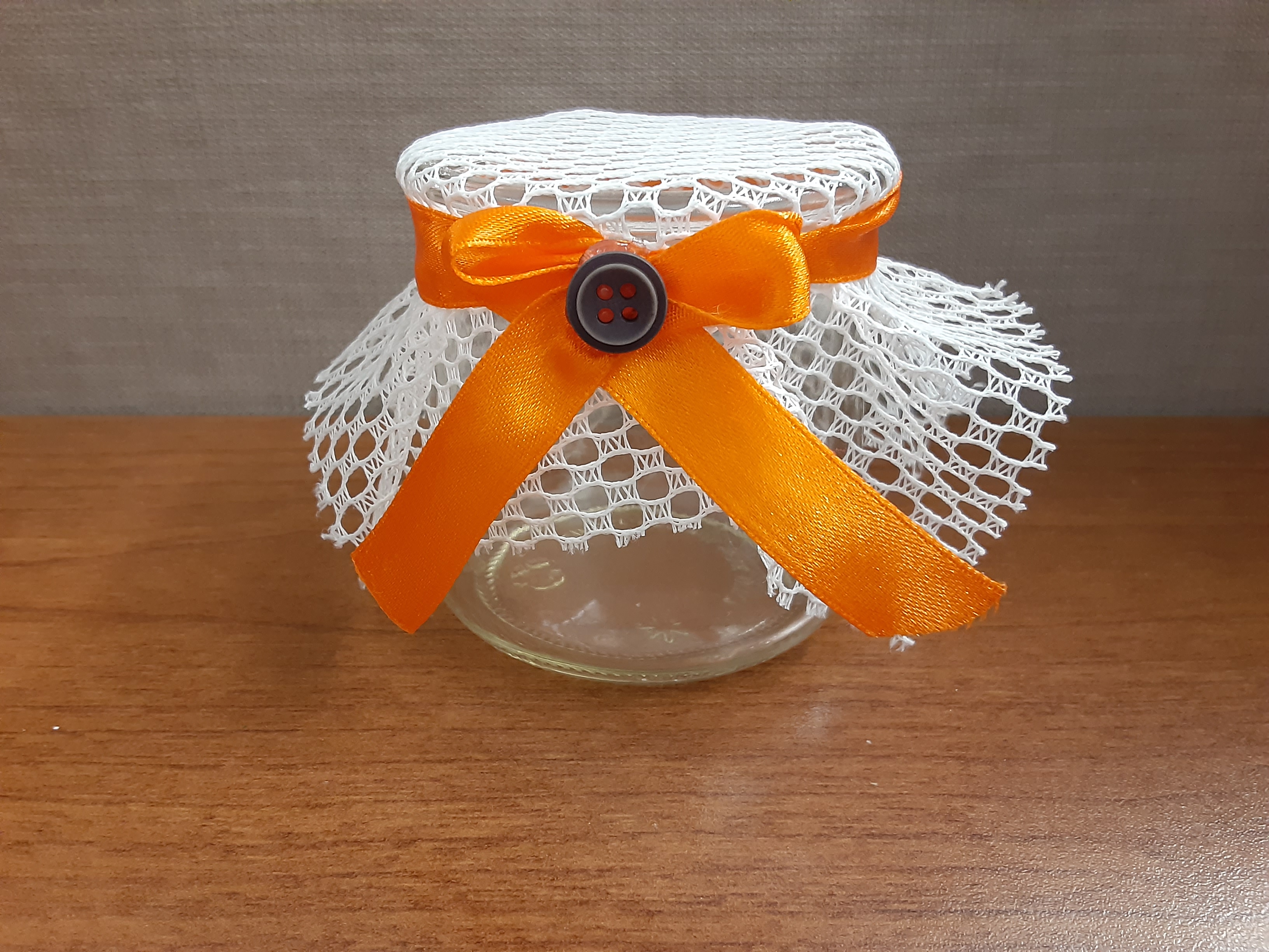 jar with orange ribbon and lace top
