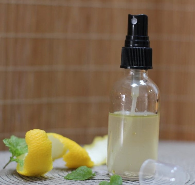 Yellow lemon peel and clear spray bottle