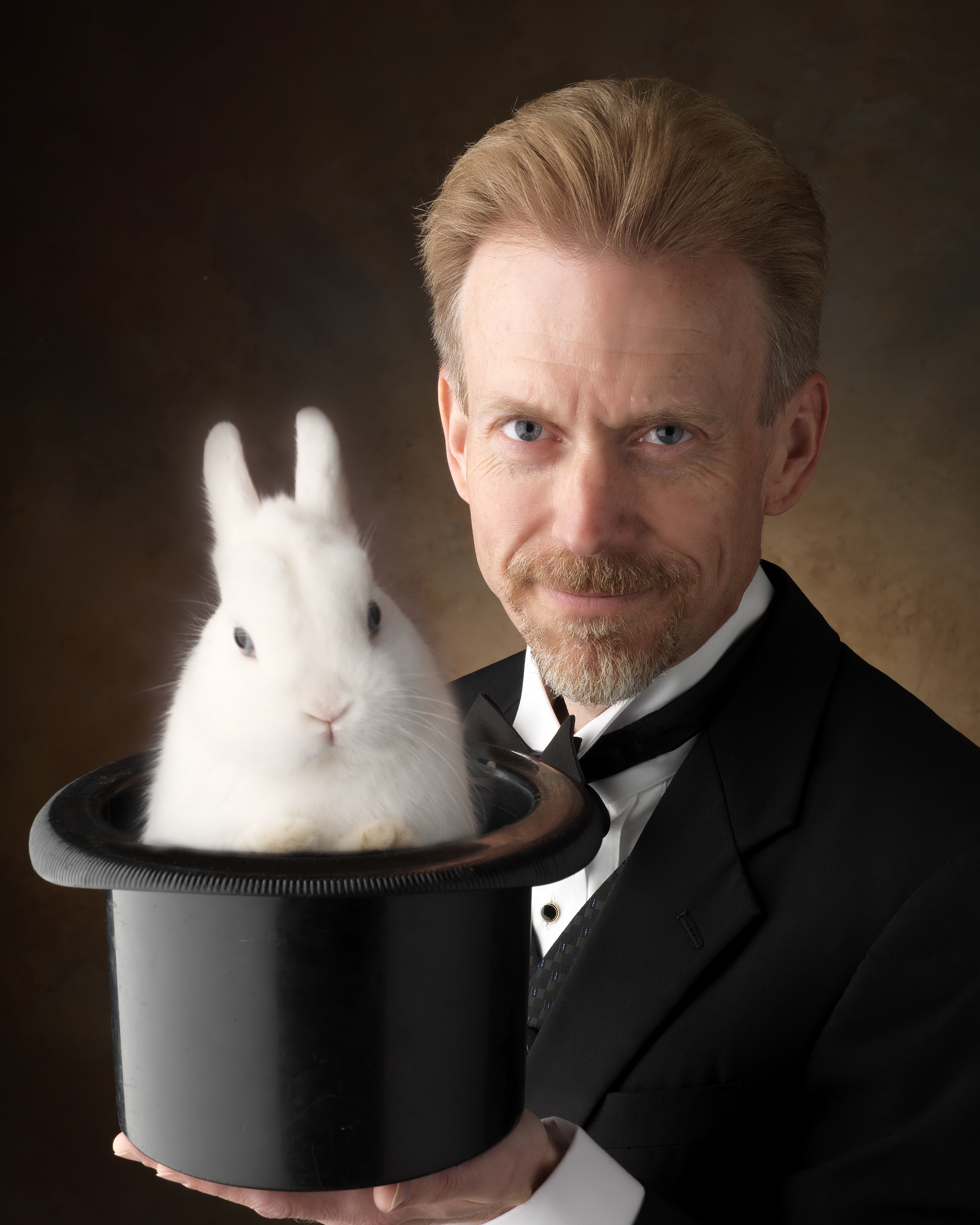 magician and bunny in black hat