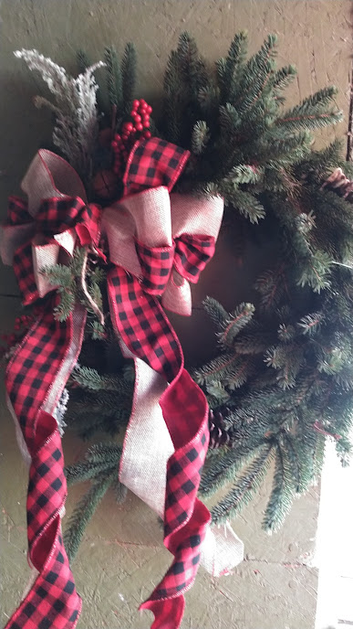 pine green wreath with red ribbon