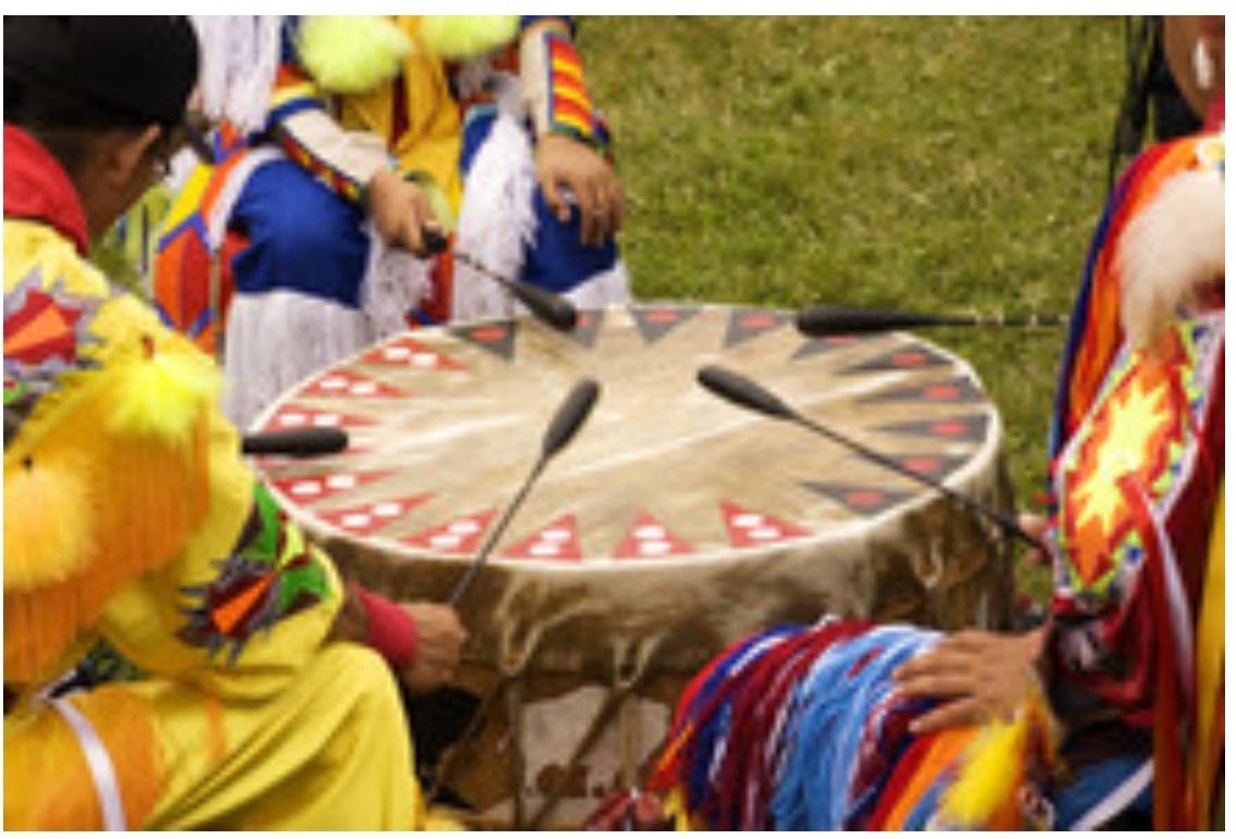 colorful clothing and brown Native American drum
