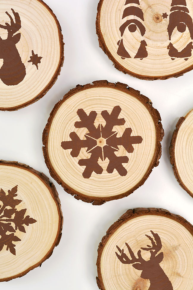 brown wooden circles with snowflake stencil