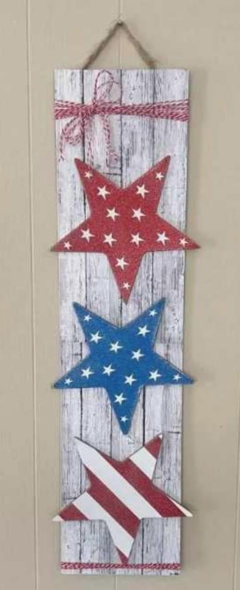 red, white, blue stars on wooden board